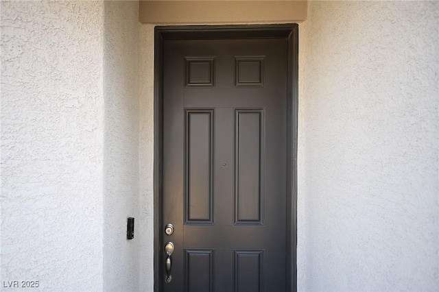 7037 Tilligerry St, North Las Vegas, NV 89084 - view of exterior entry featuring stucco siding