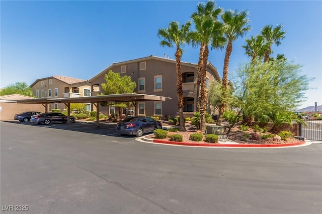 8805 Jeffreys St Unit 1003, Las Vegas, NV 89123 - view of building exterior featuring covered parking