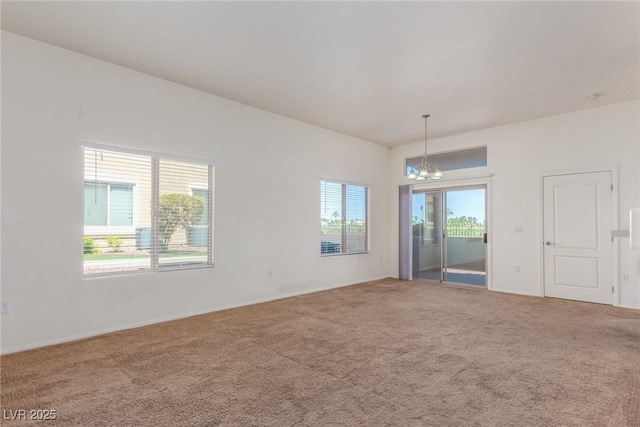 8805 Jeffreys St Unit 1003, Las Vegas, NV 89123 - empty room with a chandelier and carpet floors