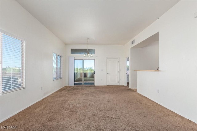 8805 Jeffreys St Unit 1003, Las Vegas, NV 89123 - carpeted empty room with a chandelier and baseboards