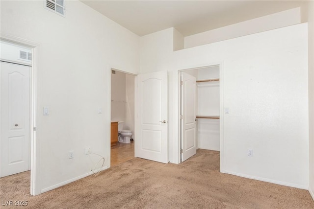 8805 Jeffreys St Unit 1003, Las Vegas, NV 89123 - unfurnished bedroom with carpet flooring, vaulted ceiling, a walk in closet, and a closet