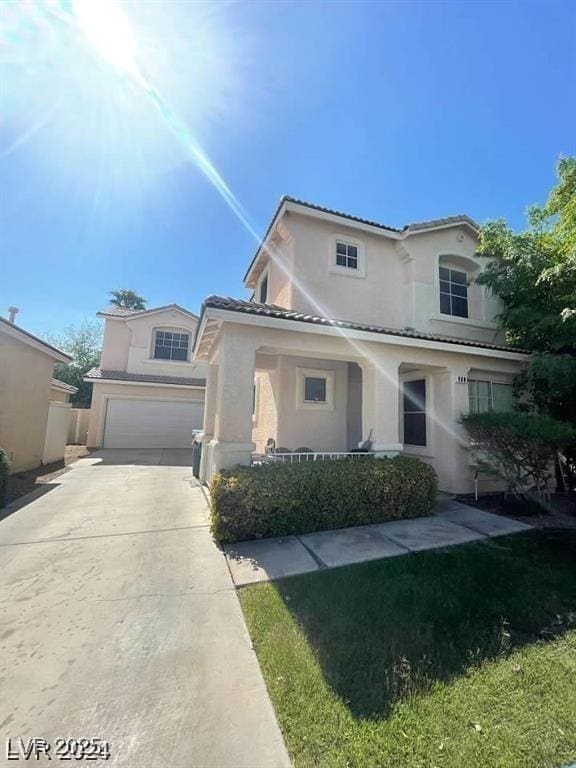 9801 Bradford Summit St, Las Vegas, NV 89183 - view of front facade with stucco siding, a garage, concrete driveway, and a tile roof