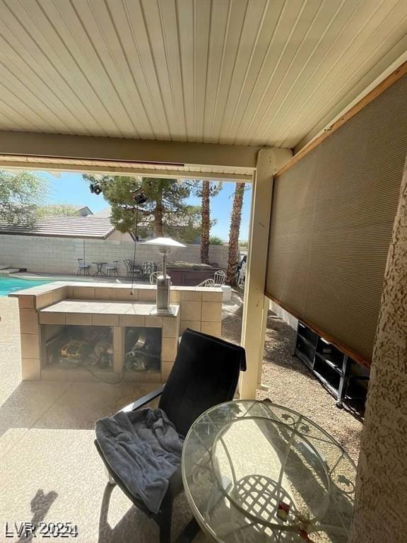 9801 Bradford Summit St, Las Vegas, NV 89183 - fenced backyard with a patio and outdoor dining area