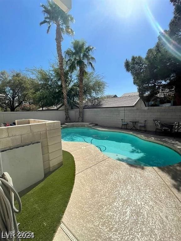 9801 Bradford Summit St, Las Vegas, NV 89183 - view of swimming pool with a patio and a fenced backyard