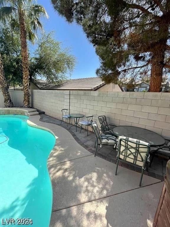 9801 Bradford Summit St, Las Vegas, NV 89183 - view of swimming pool featuring a fenced backyard and a patio area