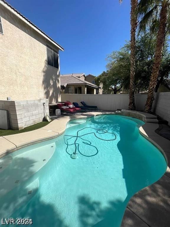 9801 Bradford Summit St, Las Vegas, NV 89183 - view of swimming pool with a fenced backyard