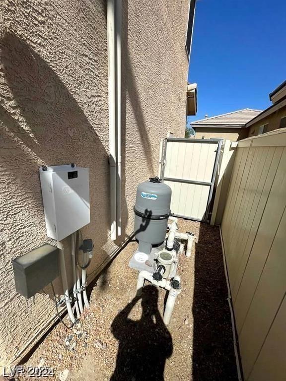 9801 Bradford Summit St, Las Vegas, NV 89183 - view of side of home with stucco siding