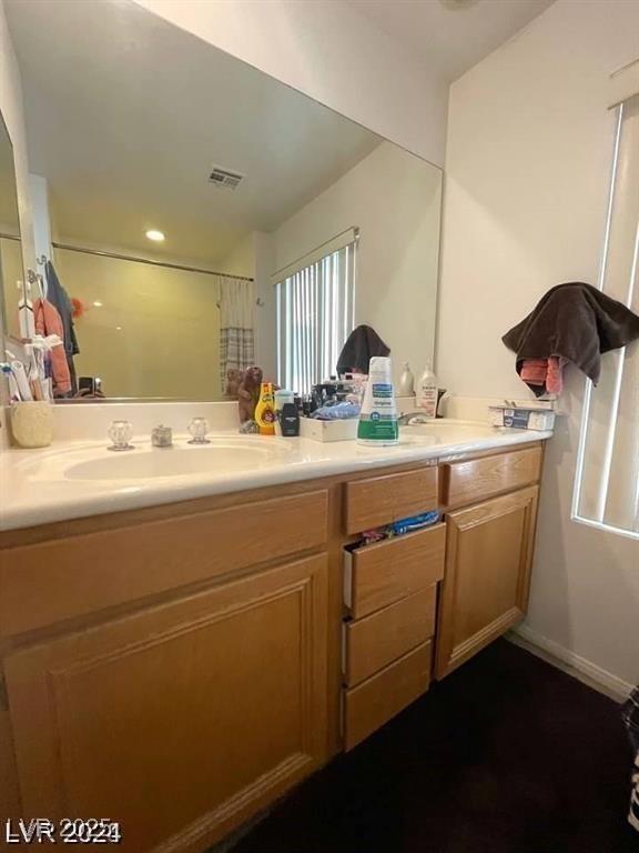 9801 Bradford Summit St, Las Vegas, NV 89183 - full bath with double vanity and a shower with shower curtain