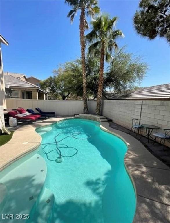 9801 Bradford Summit St, Las Vegas, NV 89183 - view of pool with a fenced backyard and a patio