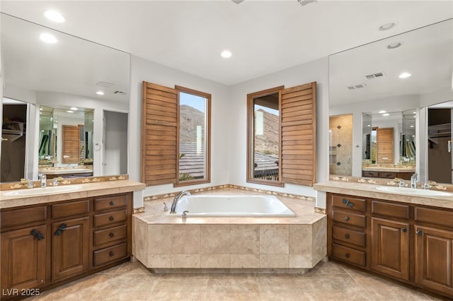 11680 Evergreen Creek Ln, Las Vegas, NV 89135 - full bath featuring a garden tub, two vanities, a stall shower, and recessed lighting