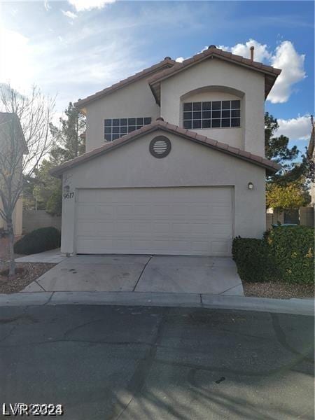 9617 Pine River Ln, Las Vegas, NV 89123 - view of front of property featuring driveway, a garage, stucco siding, and a tile roof