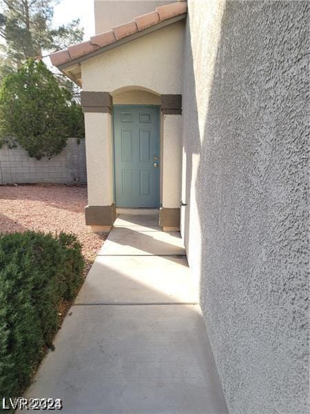 9617 Pine River Ln, Las Vegas, NV 89123 - property entrance featuring stucco siding