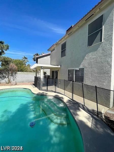 9617 Pine River Ln, Las Vegas, NV 89123 - view of swimming pool with a fenced backyard