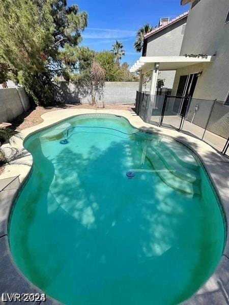 9617 Pine River Ln, Las Vegas, NV 89123 - view of swimming pool with a fenced backyard and a patio