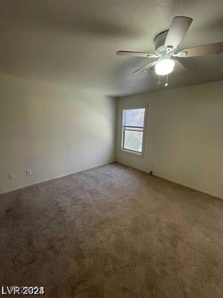 9617 Pine River Ln, Las Vegas, NV 89123 - empty room featuring carpet floors and a ceiling fan