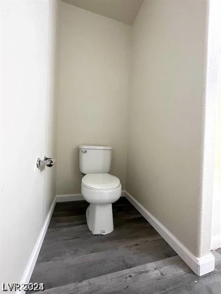 9617 Pine River Ln, Las Vegas, NV 89123 - bathroom featuring toilet and wood finished floors