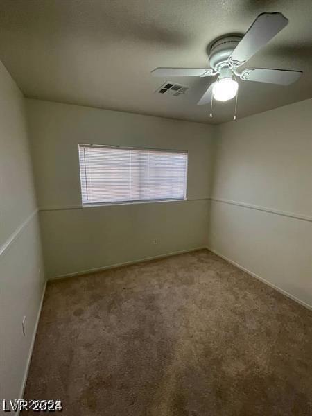 9617 Pine River Ln, Las Vegas, NV 89123 - carpeted empty room with a ceiling fan and baseboards