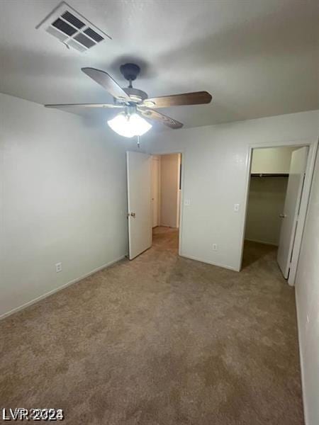 9617 Pine River Ln, Las Vegas, NV 89123 - unfurnished bedroom featuring light carpet, a spacious closet, ceiling fan, and a closet