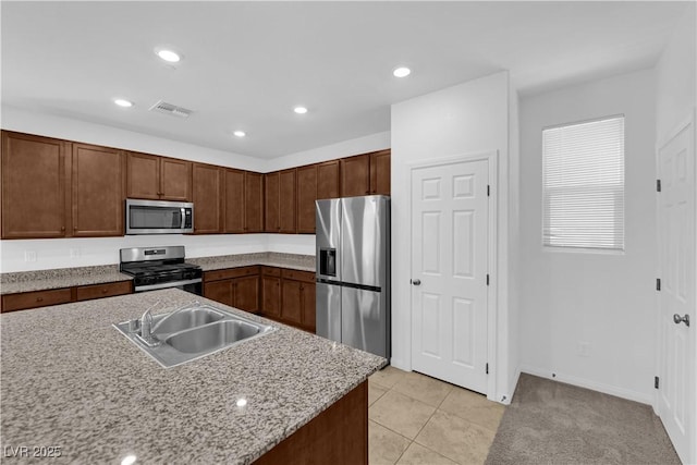 5677 Asyma Ct, Las Vegas, NV 89113 - kitchen featuring stainless steel appliances, light tile patterned flooring, and recessed lighting