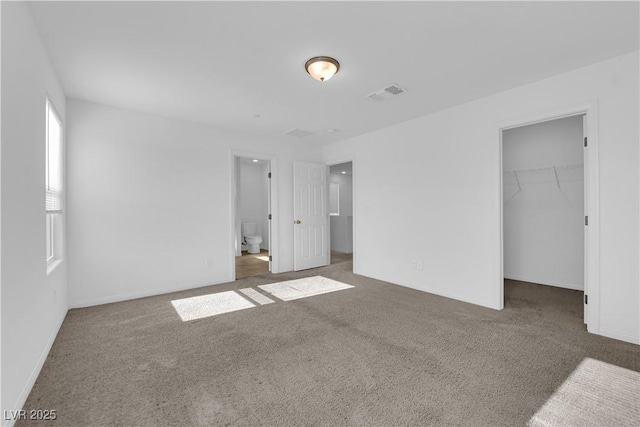 5677 Asyma Ct, Las Vegas, NV 89113 - unfurnished bedroom with carpet floors, a spacious closet, and a closet