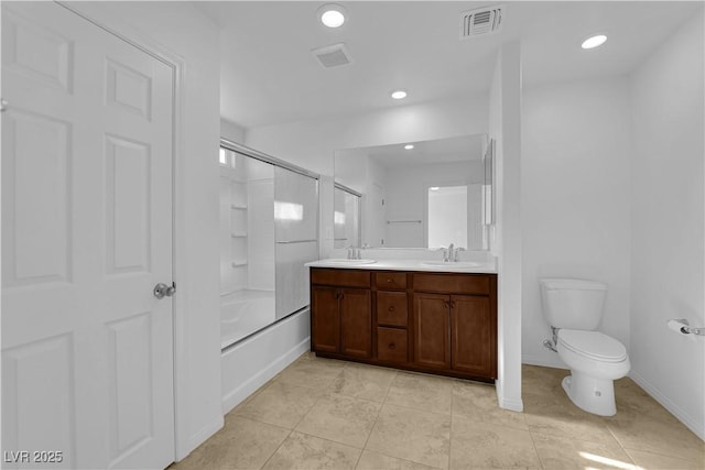 5677 Asyma Ct, Las Vegas, NV 89113 - full bathroom with double vanity, combined bath / shower with glass door, recessed lighting, and tile patterned flooring