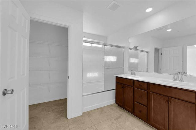 5677 Asyma Ct, Las Vegas, NV 89113 - full bath with combined bath / shower with glass door, double vanity, tile patterned floors, and recessed lighting