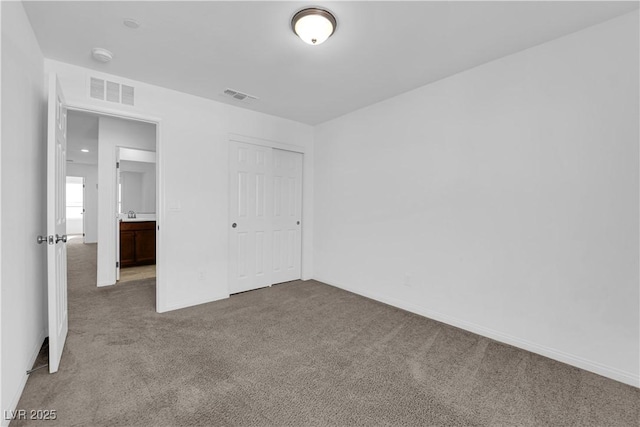 5677 Asyma Ct, Las Vegas, NV 89113 - unfurnished bedroom featuring carpet floors and a closet