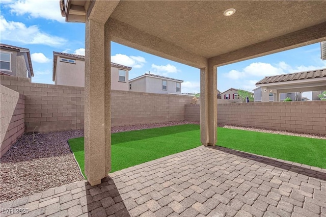 5677 Asyma Ct, Las Vegas, NV 89113 - fenced backyard with a patio