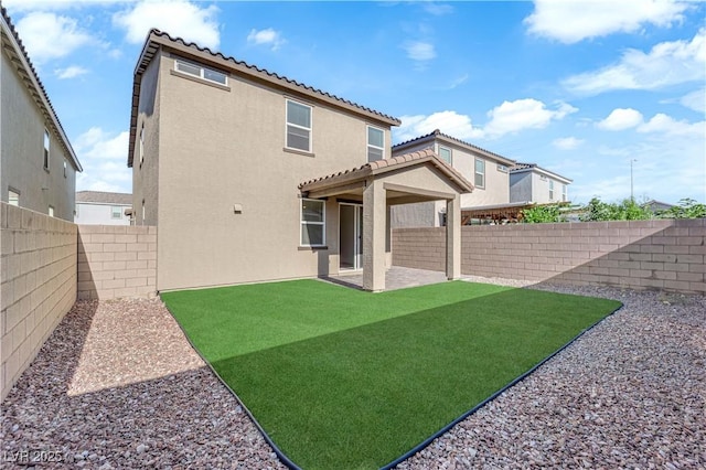 5677 Asyma Ct, Las Vegas, NV 89113 - rear view of property featuring a tile roof, stucco siding, a fenced backyard, and a patio area