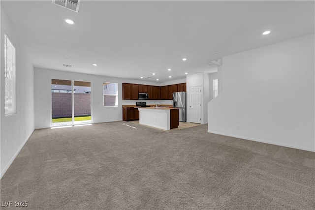 5677 Asyma Ct, Las Vegas, NV 89113 - unfurnished living room featuring light colored carpet and recessed lighting