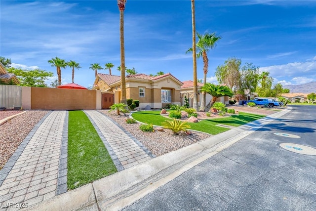 7311 Chaparral Cove Ln, Las Vegas, NV 89131 - mediterranean / spanish home with stucco siding, a tiled roof, and a gate