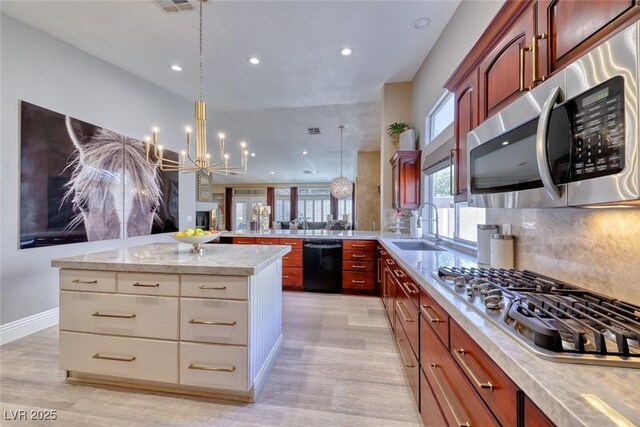 7311 Chaparral Cove Ln, Las Vegas, NV 89131 - kitchen featuring appliances with stainless steel finishes, light countertops, recessed lighting, backsplash, and a chandelier