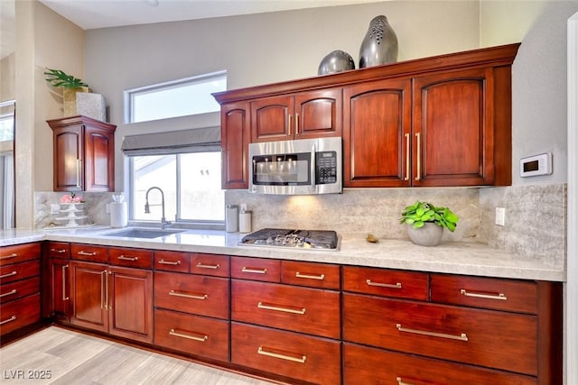 7311 Chaparral Cove Ln, Las Vegas, NV 89131 - kitchen featuring appliances with stainless steel finishes, light countertops, and dark brown cabinets
