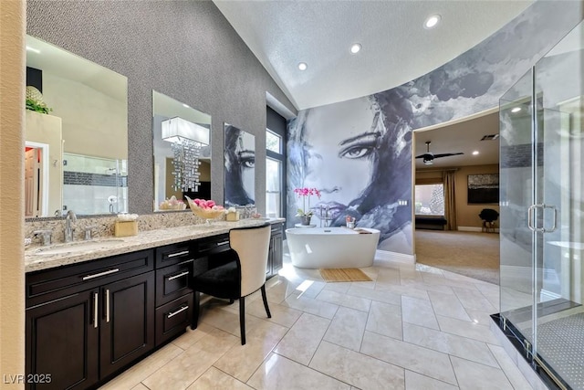 7311 Chaparral Cove Ln, Las Vegas, NV 89131 - bathroom with an accent wall, plenty of natural light, vaulted ceiling, a stall shower, and recessed lighting