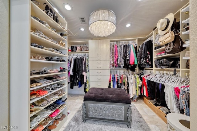 7311 Chaparral Cove Ln, Las Vegas, NV 89131 - walk in closet featuring a chandelier