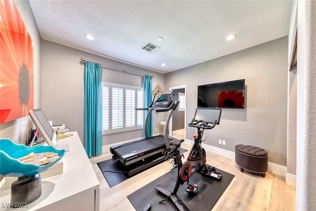 7311 Chaparral Cove Ln, Las Vegas, NV 89131 - workout area with wood finished floors, recessed lighting, and a textured ceiling