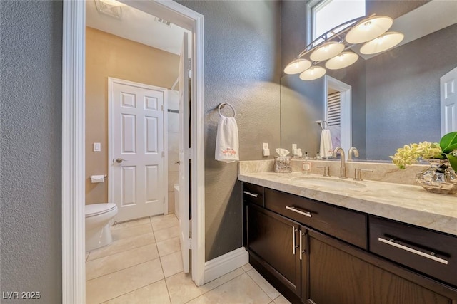 7311 Chaparral Cove Ln, Las Vegas, NV 89131 - bathroom with a textured wall, vanity, and tile patterned flooring