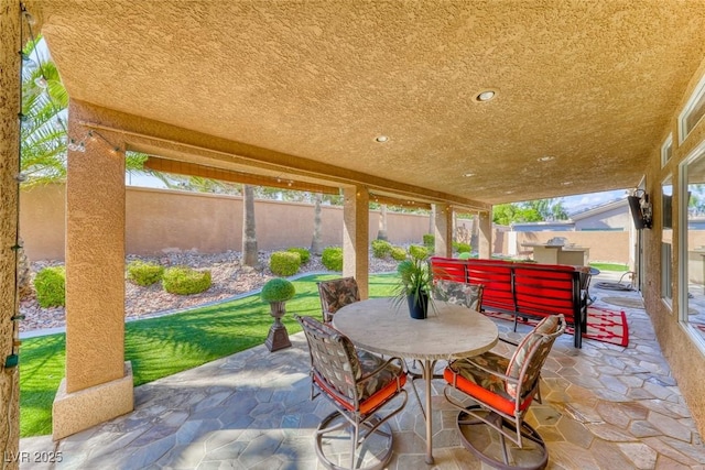 7311 Chaparral Cove Ln, Las Vegas, NV 89131 - fenced backyard featuring outdoor dining space and a patio area