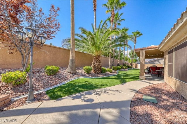 7311 Chaparral Cove Ln, Las Vegas, NV 89131 - fenced backyard with a patio area
