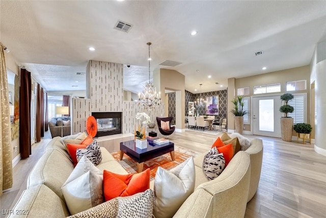 7311 Chaparral Cove Ln, Las Vegas, NV 89131 - living room with a chandelier, healthy amount of natural light, light wood-type flooring, and recessed lighting