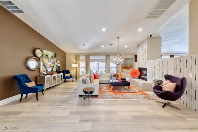 7311 Chaparral Cove Ln, Las Vegas, NV 89131 - living area featuring plenty of natural light, light wood-type flooring, a chandelier, and recessed lighting