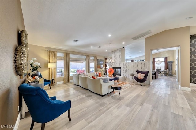 7311 Chaparral Cove Ln, Las Vegas, NV 89131 - living room with light wood-style flooring, recessed lighting, and a multi sided fireplace