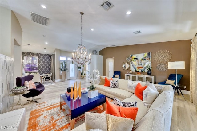 7311 Chaparral Cove Ln, Las Vegas, NV 89131 - living room with a chandelier, light wood finished floors, recessed lighting, and an accent wall