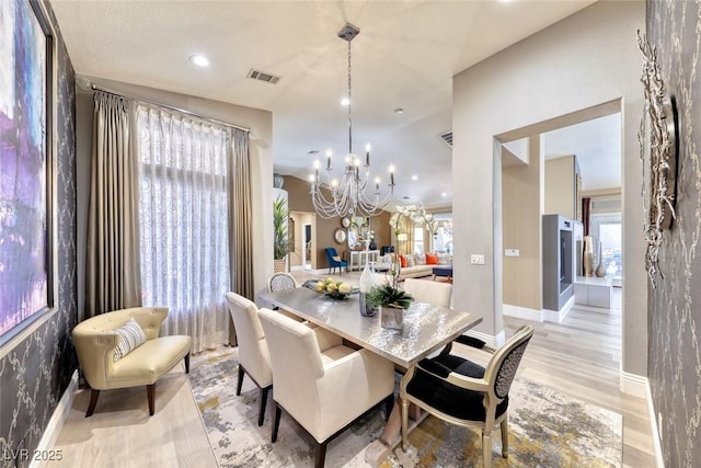 7311 Chaparral Cove Ln, Las Vegas, NV 89131 - dining area with light wood-style floors, a chandelier, and recessed lighting