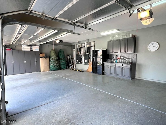 7311 Chaparral Cove Ln, Las Vegas, NV 89131 - garage featuring a garage door opener, black fridge with ice dispenser, and heating unit