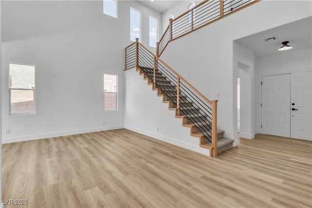1551 Boundary Peak Way, Las Vegas, NV 89135 - entrance foyer with a high ceiling, stairway, light wood-style flooring, and plenty of natural light
