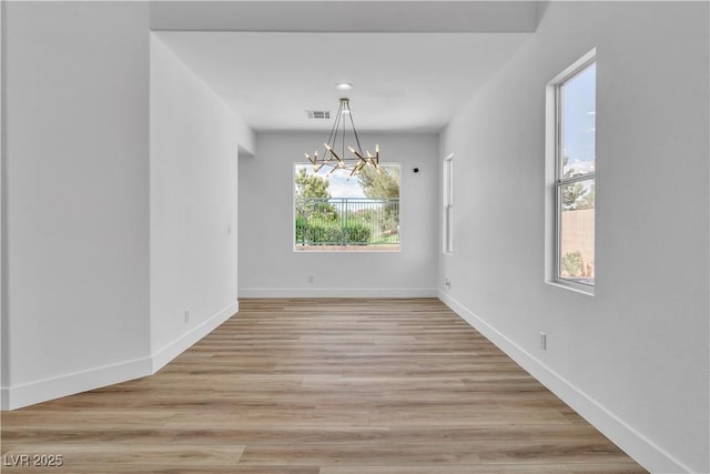 1551 Boundary Peak Way, Las Vegas, NV 89135 - spare room with a chandelier and light wood-type flooring