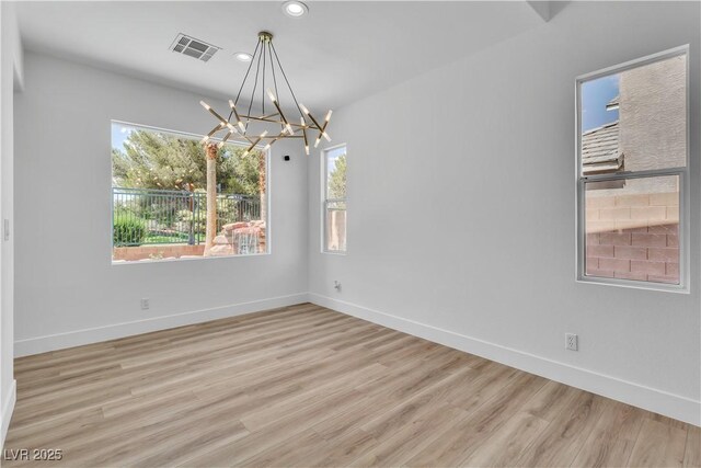 1551 Boundary Peak Way, Las Vegas, NV 89135 - unfurnished room with a chandelier, recessed lighting, and wood finished floors
