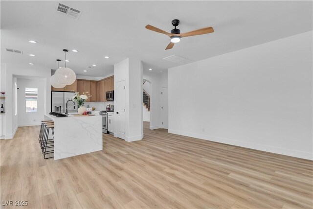 1551 Boundary Peak Way, Las Vegas, NV 89135 - unfurnished living room with recessed lighting, light wood-style flooring, and a ceiling fan