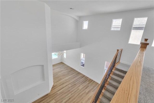1551 Boundary Peak Way, Las Vegas, NV 89135 - staircase featuring wood finished floors and a chandelier